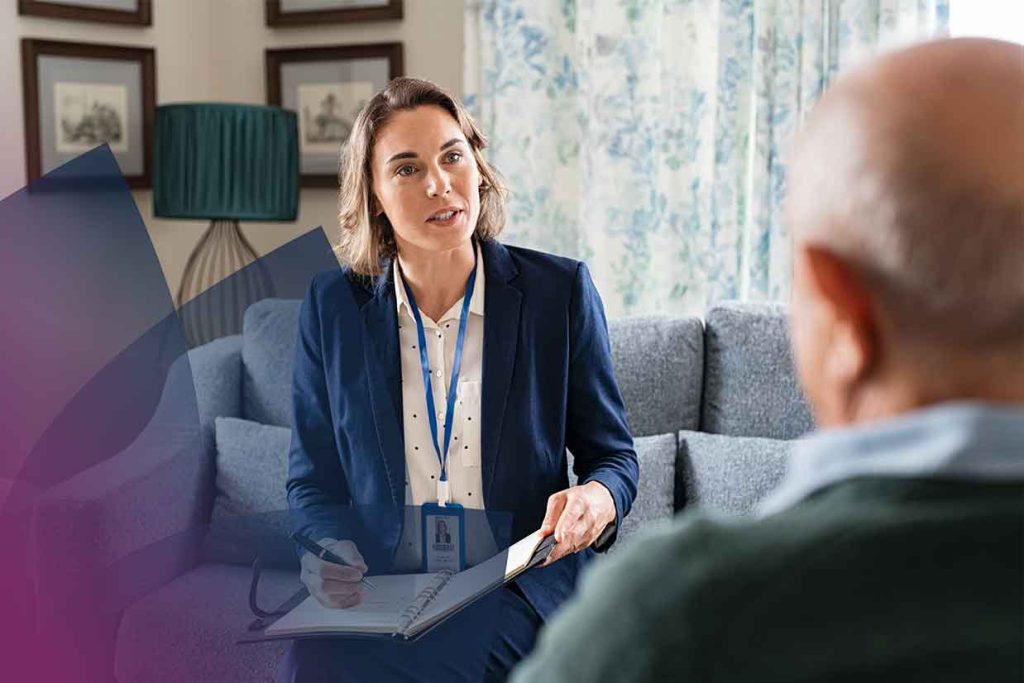 Image shows NDIS support worker assisting an NDIS Participant.